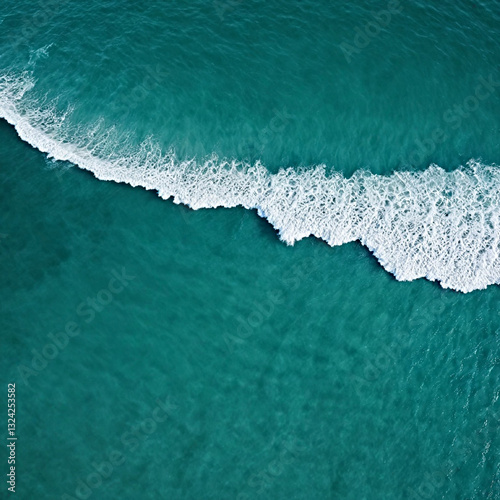 Aerial view beautiful of sea waves from drone. Stock image of blue color of ocean water, sea surface. Top view on turquoise waves, clear water surface texture.