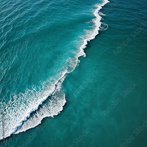 Aerial view beautiful of sea waves from drone. Stock image of blue color of ocean water, sea surface. Top view on turquoise waves, clear water surface texture.