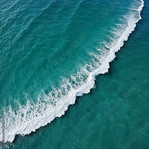 Aerial view beautiful of sea waves from drone. Stock image of blue color of ocean water, sea surface. Top view on turquoise waves, clear water surface texture.