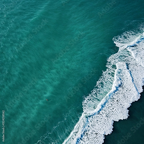 Aerial view beautiful of sea waves from drone. Stock image of blue color of ocean water, sea surface. Top view on turquoise waves, clear water surface texture.