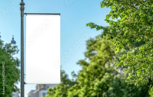 Blank Advertising Banner on Light Post in City Park Setting
