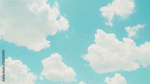 Panoramic blue sky with fluffy white clouds, a bright and clear atmosphere, perfect for a background banner or nature-themed design. photo
