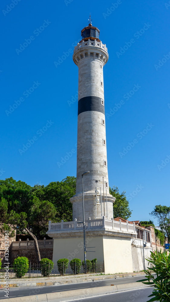 Ahirkapi Feneri is historical lighthouse at southern Seraglio Point outside of city walls south of Topkapi Palace, Fatih district, Istanbul, Turkey. Vertical image Ahirkapi Feneri is historical lighthouse at southern Seraglio Point outside of city walls south of Topkapi Palace, Fatih district, Istanbul, Turkey. Vertical image