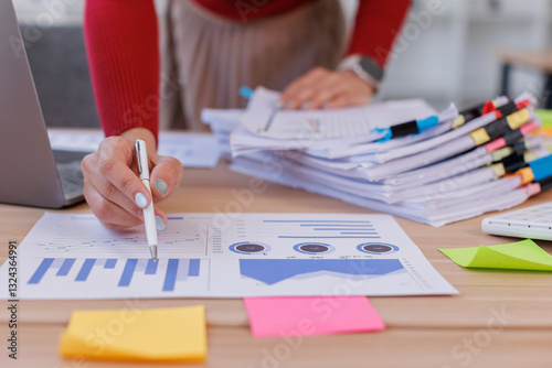 Business Business Documents, woman hands working in Stacks of paper files for searching and checking unfinished document achieves on folders papers
