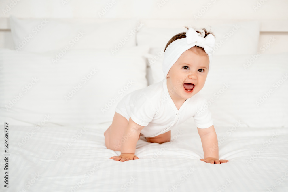 smiling little child or baby girl in a white bodysuit on the bed rejoices, healthy happy baby in the bedroom, space for text smiling little child or baby girl in a white bodysuit on the bed rejoices, healthy happy baby in the bedroom, space for text
