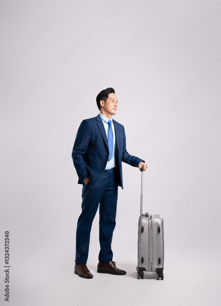 Full body image of Asian business man wearing a suit ,pull suitcase and posing on a white background Full body image of Asian business man wearing a suit ,pull suitcase and posing on a white background
