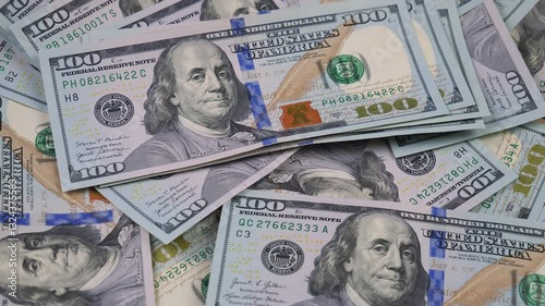 Wallpaper Mural American dollars, slowly rotating. Top view. Slow motion. Torontodigital.ca