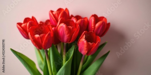 A bouquet of red tulips featuring a delicate heart shape, flowers, bouquet