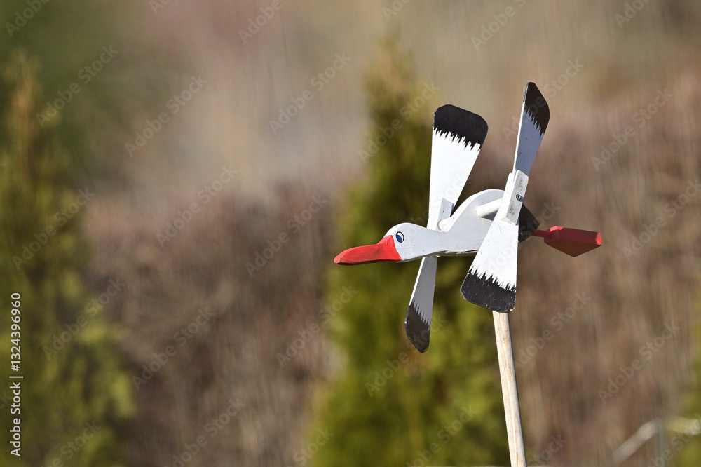 Wooden garden decoration in the form of a flying stork
