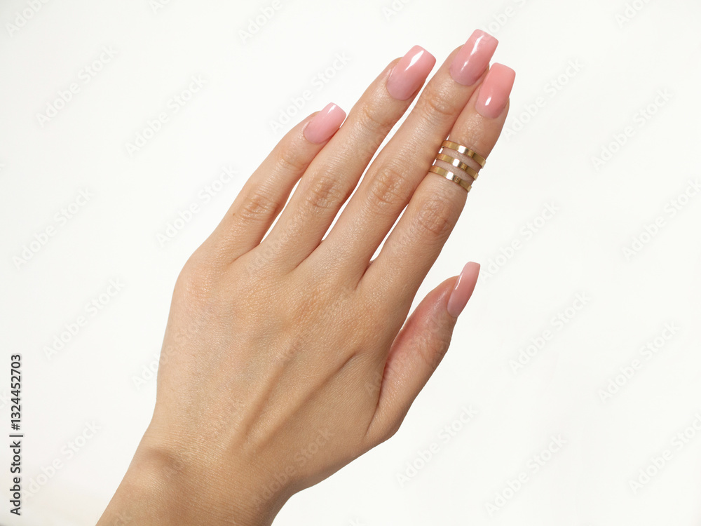 Hand with long manicured nails gel acrylic in pink colors Hand with long manicured nails gel acrylic in pink colors