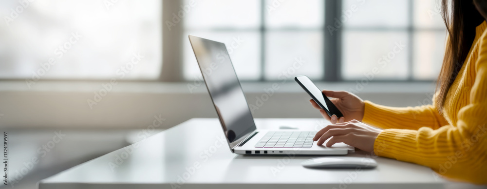 woman hand typing on laptop computer and using mobile phone at bright modern coworking office. internet business concept. banner with copy space woman hand typing on laptop computer and using mobile phone at bright modern coworking office. internet business concept. banner with copy space