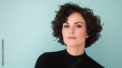 Modern chic hairstyle with voluminous curly layers and faded sides