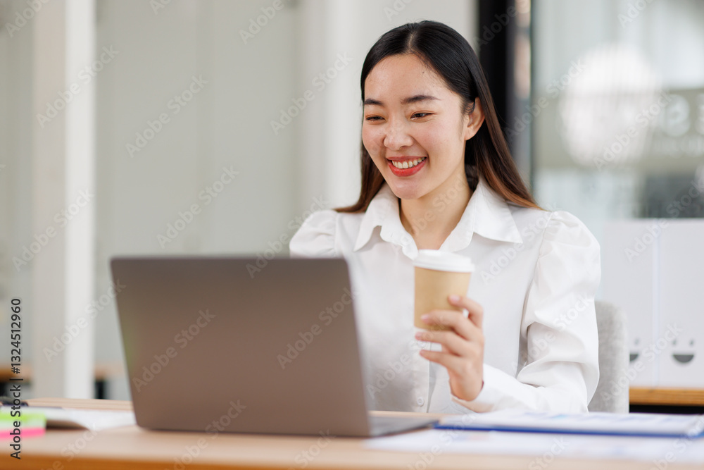Young confident smiling asian woman using laptop at workplace office. online business work.
Young confident smiling asian woman using laptop at workplace office. online business work.