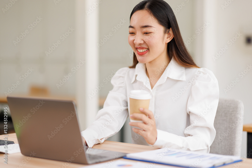 Young confident smiling asian woman using laptop at workplace office. online business work.
Young confident smiling asian woman using laptop at workplace office. online business work.