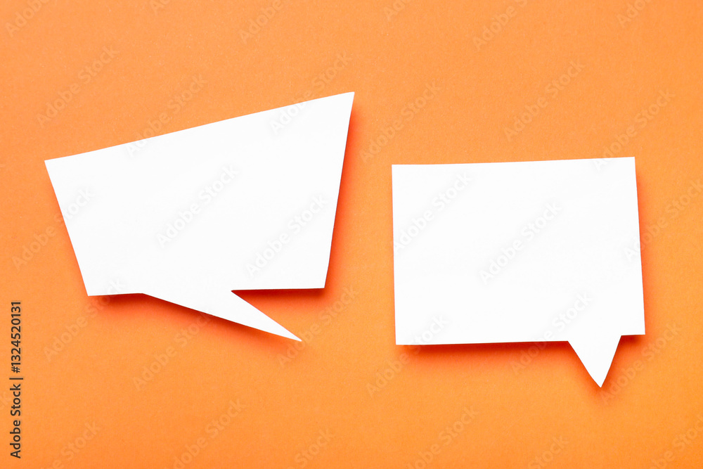 Blank speech bubbles on orange background, top view. Space for text Blank speech bubbles on orange background, top view. Space for text