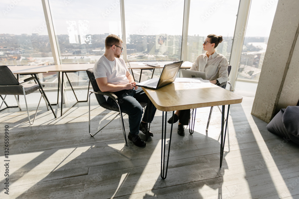 Two office workers working to together Two office workers working to together