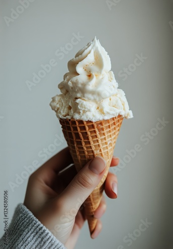 Enjoying a Delicious Ice Cream Cone at Home With a Soft and Fluffy Scoop on a...