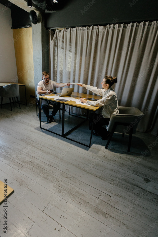 Two office workers working to together Two office workers working to together
