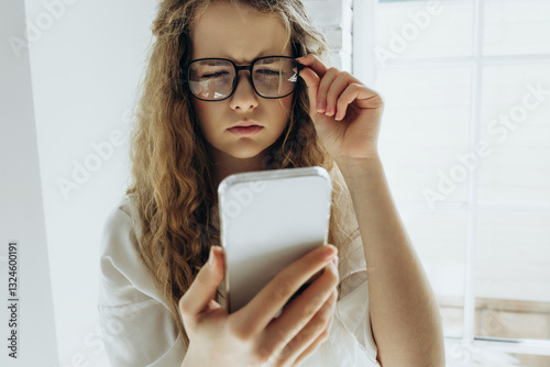 Poor vision. Young woman with glasses, girl with poor vision on white background
