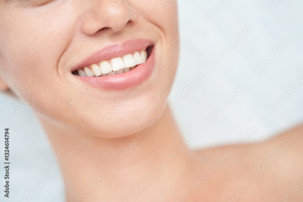 Close up of smiling caucasian female with perfect teeth and smooth skin. Close up of smiling caucasian female with perfect teeth and smooth skin.