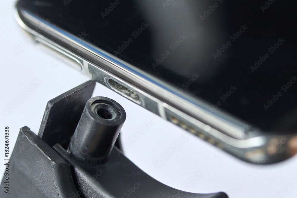 Ταπετσαρία Close up shot of smartphone with visible dirt in charging port on white background