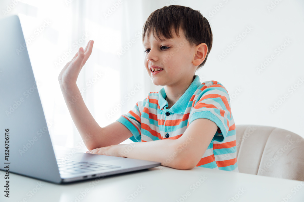 Boy Sitting At Table With Laptop Learning Games Online Boy Sitting At Table With Laptop Learning Games Online