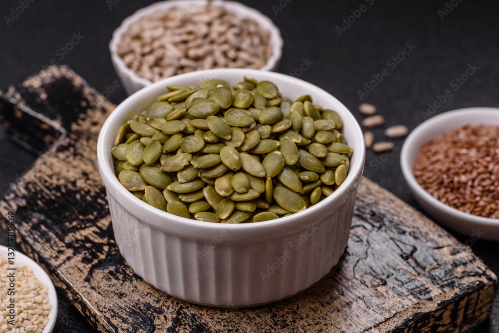 Peeled pumpkin seeds in a bowl, an ingredient for making vegetarian food Peeled pumpkin seeds in a bowl, an ingredient for making vegetarian food
