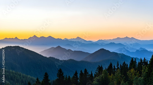 Panoramic View Of Mountains In Blue Hues With Dense Forest And Vibrant Sunset Sky