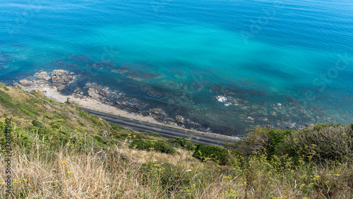 Street and Cliffs at Escarpment Track with crystal clear water, New Zealand