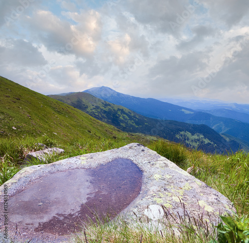 Obraz na płótnie Small puddle on mountain stone with view to summer mountain landscape and cloud reflection (Ukraine, Carpathian Mountains) w salonie