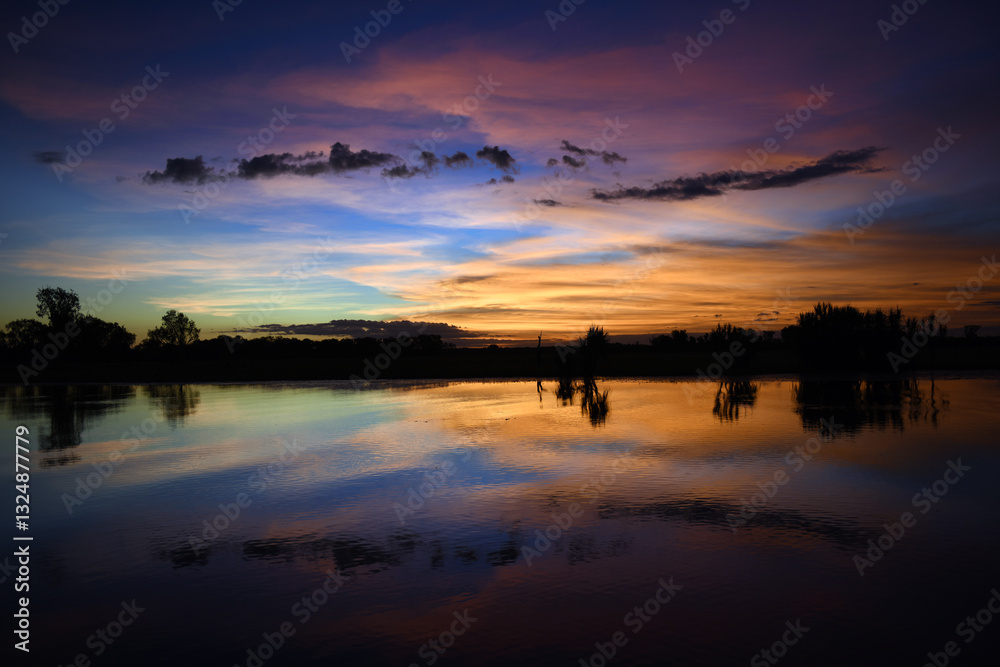 Obraz premium spectacularly and colorful sunset at Yellow Waters Billabong, Kakadu National Park, Northern Territory, Australia 