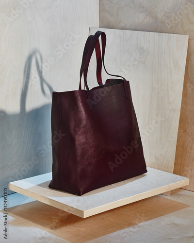  bag maroon tote red leather wood background 