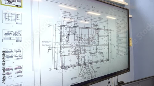 large secret drawings are displayed on the architect's screen