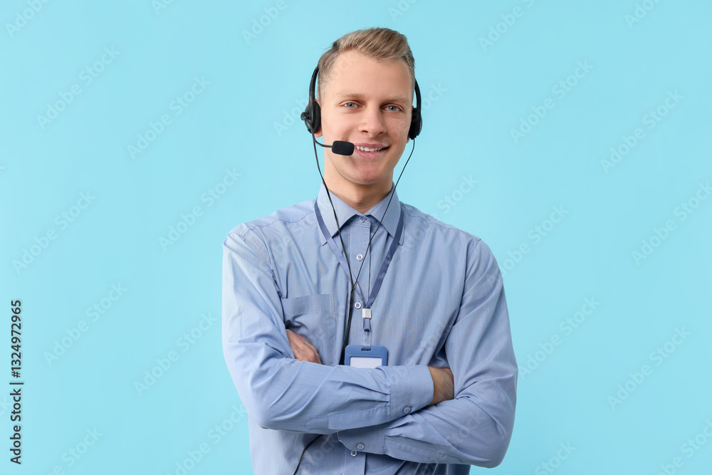 Technical support call center. Smiling operator with crossed arms on light blue background Technical support call center. Smiling operator with crossed arms on light blue background