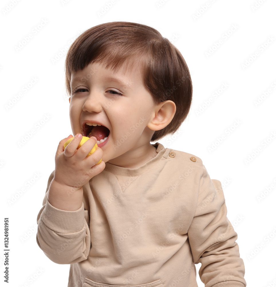 Cute little child eating tasty mochi on white background Cute little child eating tasty mochi on white background