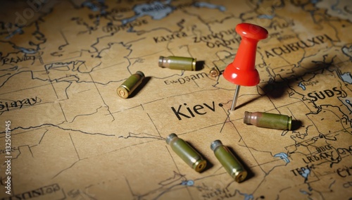 A map marks Kiev with a red pin while several bullet casings lie nearby, signifying the ongoing conflict and unrest in the area