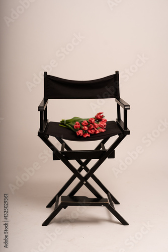 black director's chair with flowers