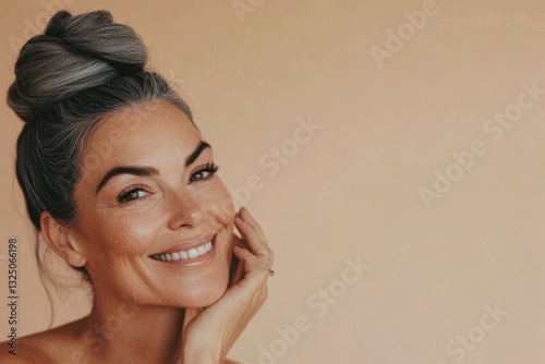 Portrait of a happy woman with gray hair styled in a bun, radiating confidence and joy. Generated AI