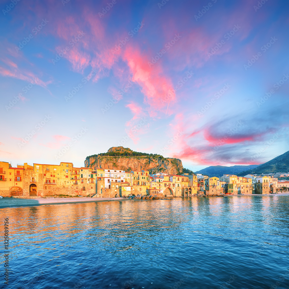 Picturesque evening cityscape of Cefalu city. Popular travel destination of Mediterranean sea.