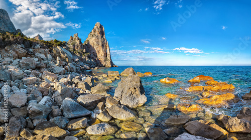 Obraz na płótnie Exciting view of Punta Pedra Longa and azure water in sea. w salonie