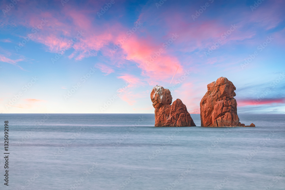 Remarkable sunset view of Red Rocks (is Scoglius Arrubius) on Cea beach