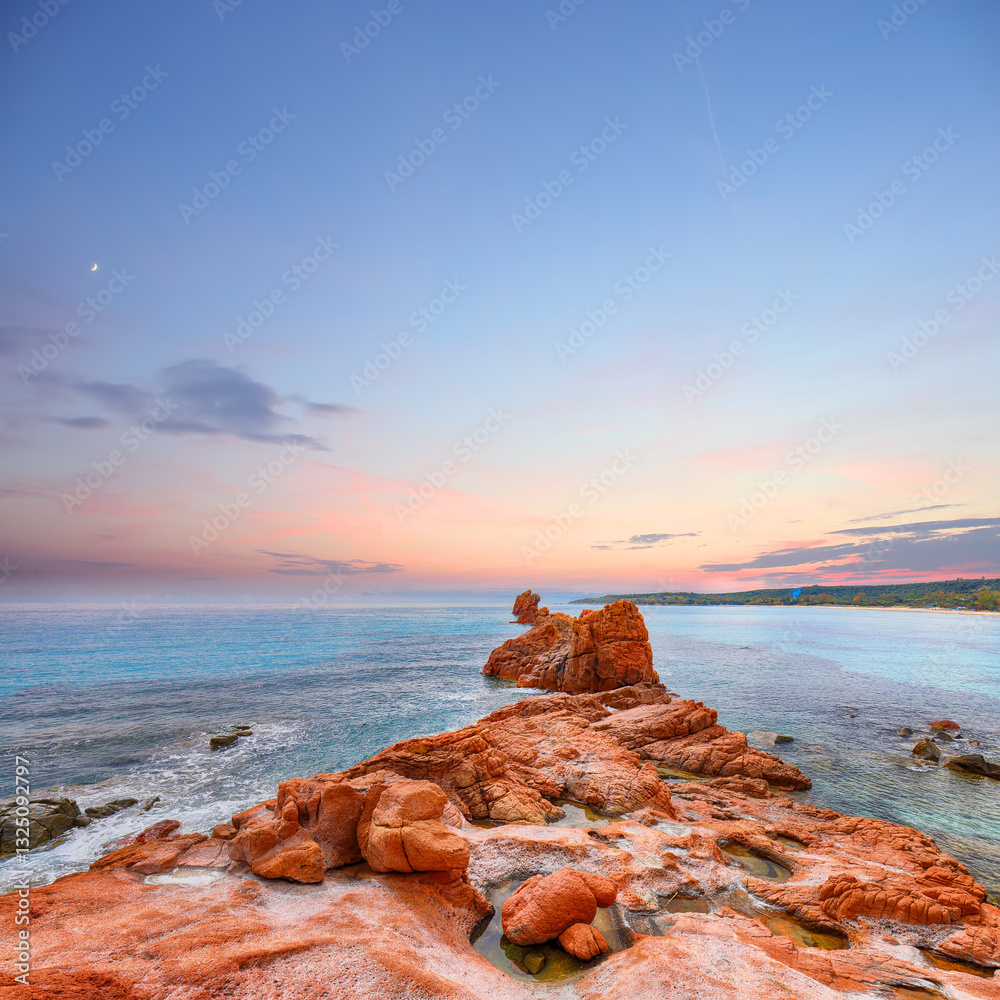 Remarkable sunset view of Red Rocks (is Scoglius Arrubius) on Cea beach