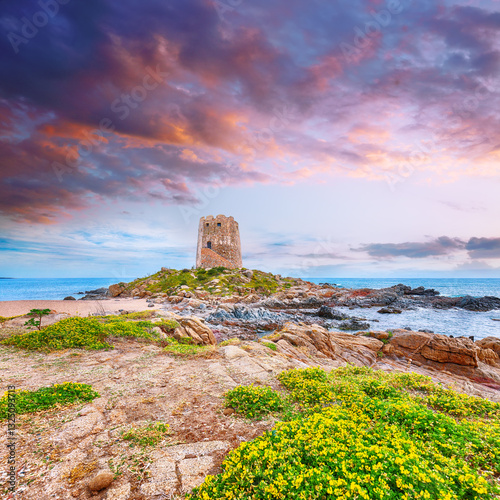 Obraz na płótnie Exciting sunset view of Bari Sardo tower in the Gulf of Orosei. w salonie