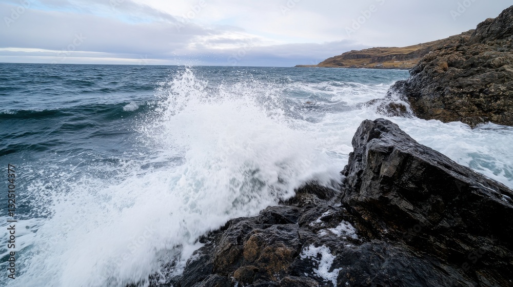 A dramatic coastline with jagged rocks and crashing waves A dramatic coastline with jagged rocks and crashing waves
