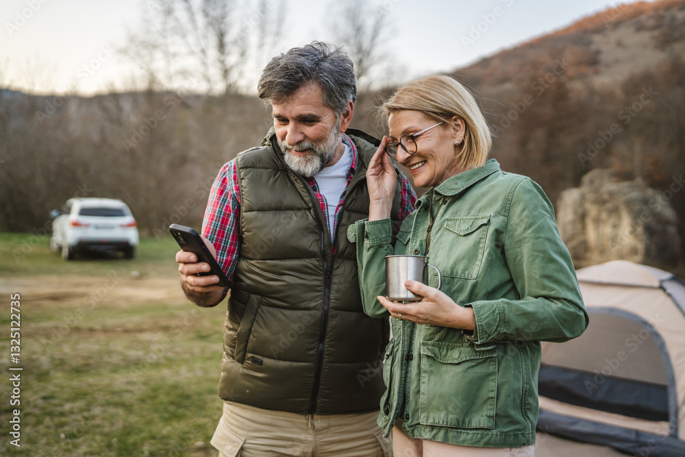 Fototapeta premium mature couple husband and wife use cellphone for fun or exploration