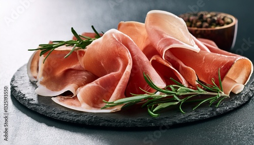 italian prosciutto crudo or jamon with rosemary raw ham photo