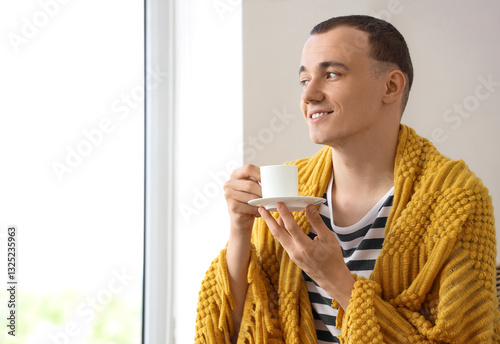 Young man with plaid and cu...