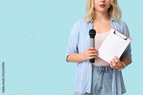 Female journalist with microphone and clipboard on blue background