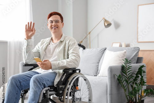 Young man in wheelchair wit...