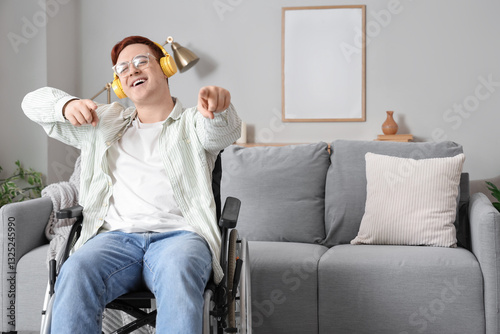 Young man in wheelchair wit...